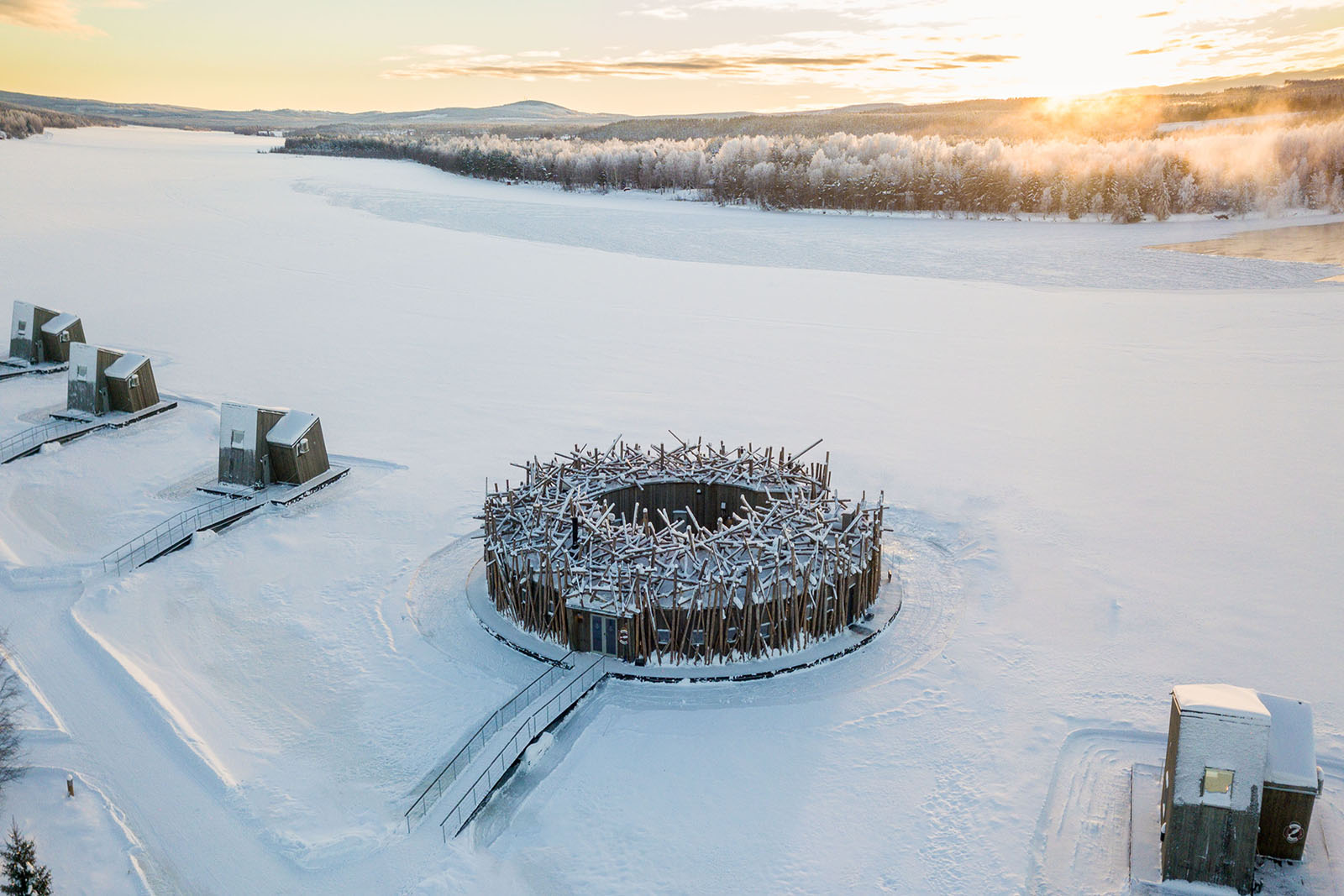 Circular Arctic Bath hotel on a frozen river